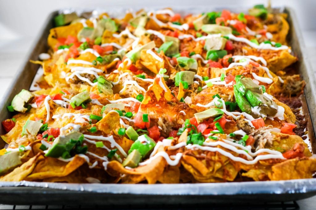 Kalua Pork Nachos with Cheese and Jalapeños