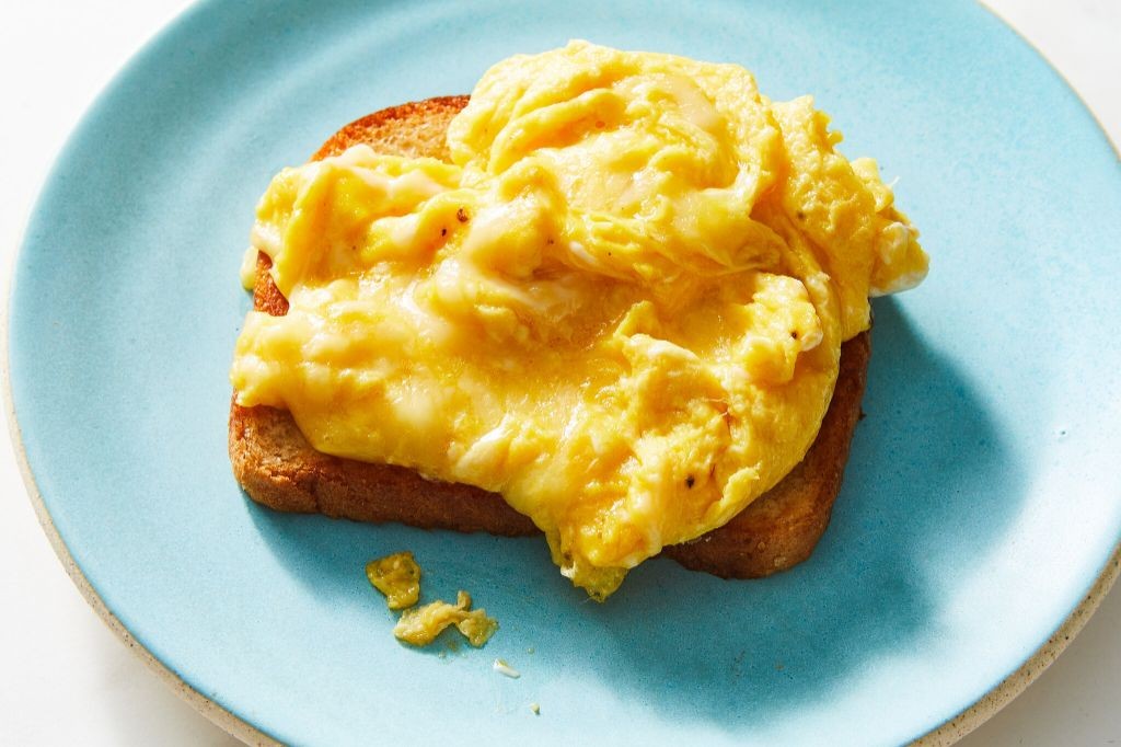 Egg and cheese scramble on toast